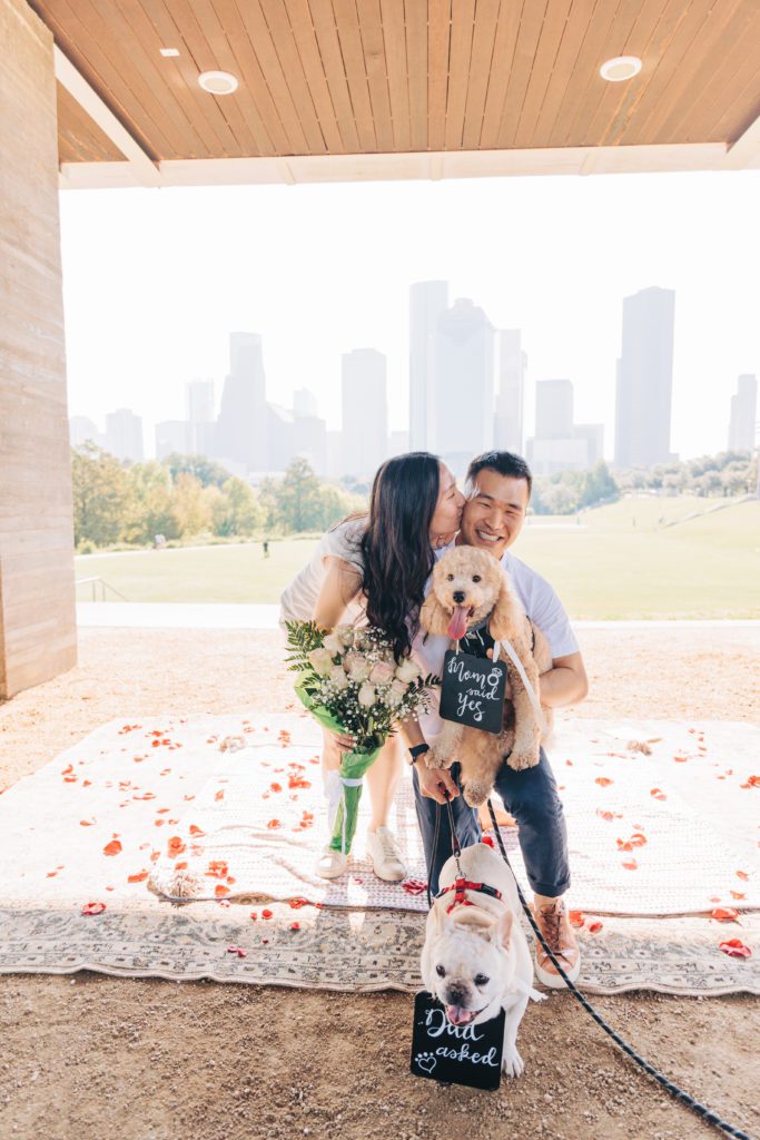 family with dogs after getting engaged