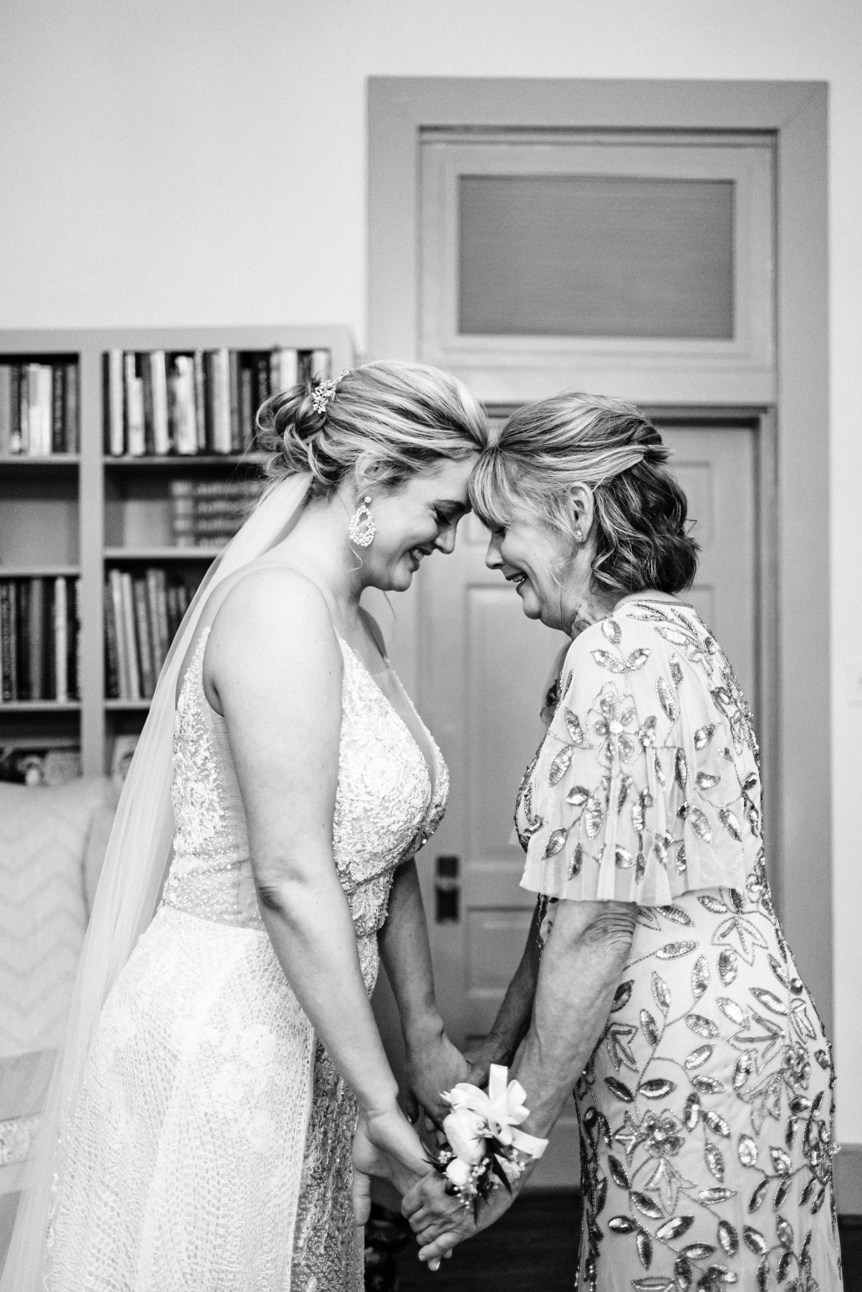 mom with bride getting ready