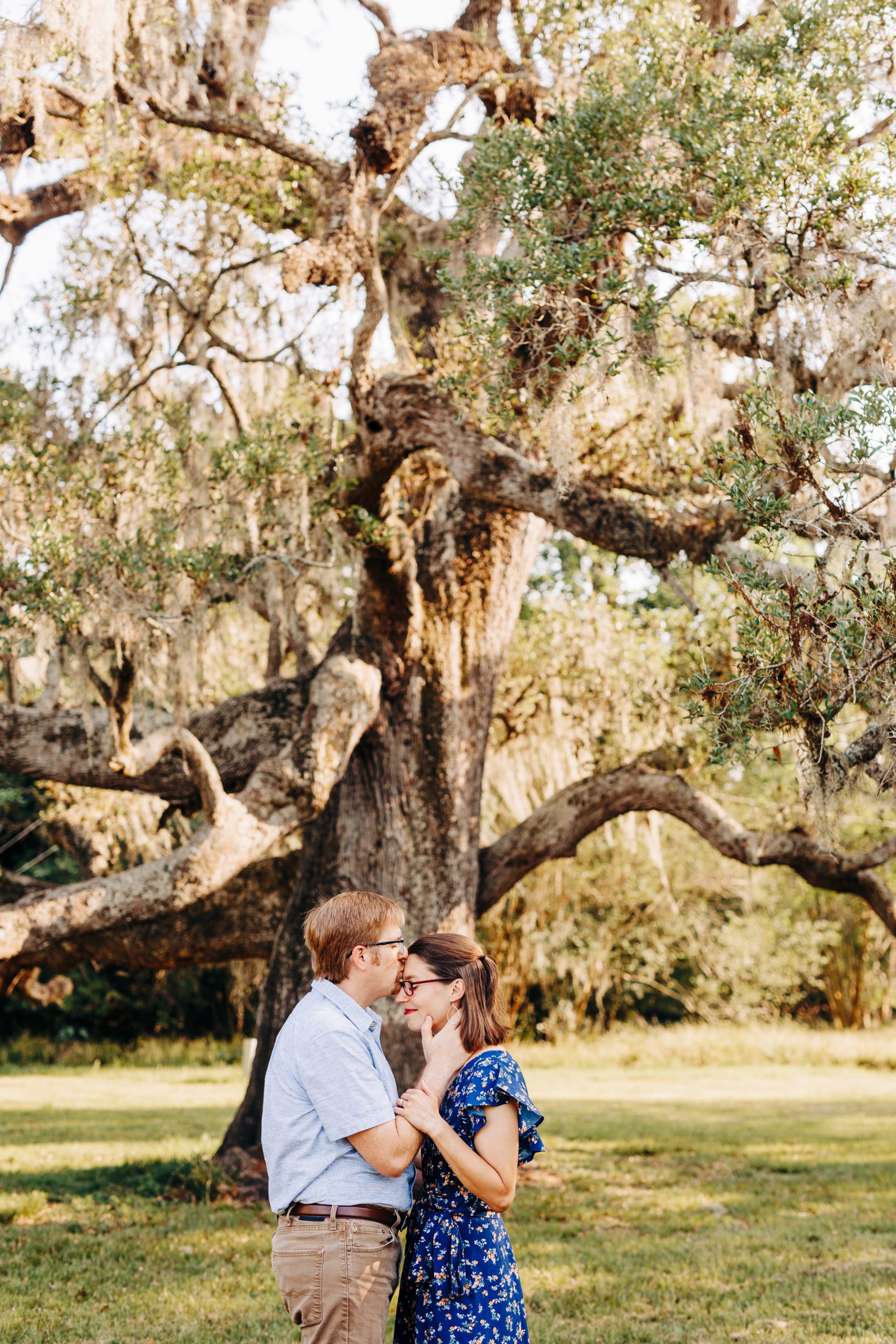 couple in front of large tree at Brazos Bend taken by a Brazos Bend Engagement Photographer